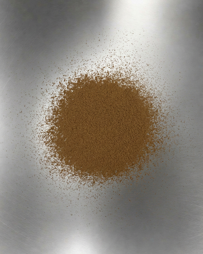 TEAWERX TERRACOTTA Brown hojicha (houjicha) powder on a metallic surface